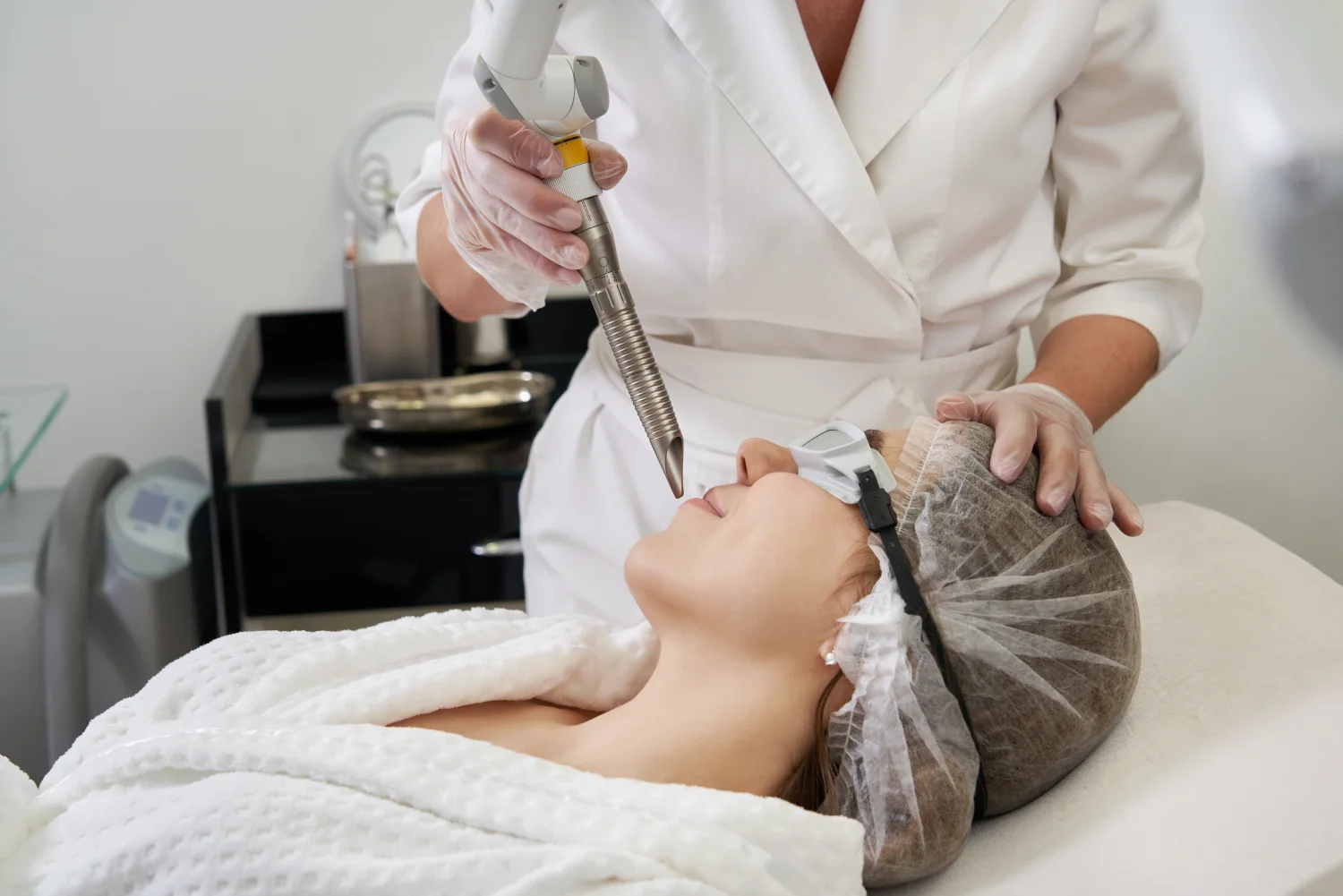 young-woman-receiving-laser-treatment-cosmetology-clinic